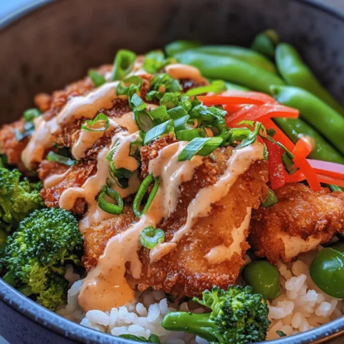 If you're searching for a dish that combines vibrant flavors, eye-catching presentation, and wholesome nutrition, look no further than the Bang Bang Chicken Bowl. This delightful meal is a feast for both the eyes and the palate, showcasing tender chicken, colorful vegetables, and fragrant rice, all beautifully drizzled with a creamy and spicy Bang Bang sauce. It not only satisfies hunger but also offers a burst of flavors that will make your taste buds dance.
